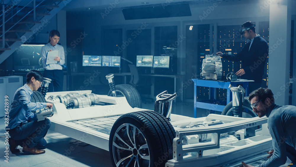 Poster automotive design engineers work and do tests on electric car chassis prototype. in innovation labor
