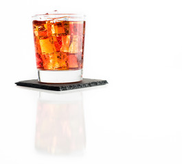 Whisky on rocks isolated on white background