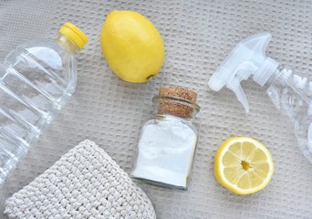 Natural, eco friendly ingredients for home cleaning, lemon, soda, vinegar, zero waste lifestyle, flat lay.