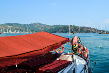 Fototapeta na wymiar Roof of red fabric of a tourist boat. Turkey, Fethiye