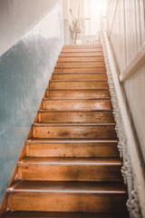 Old wooden staircase to the second floor - antique interior