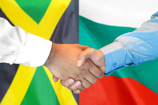 handshake on Jamaica and Bulgaria flag background.