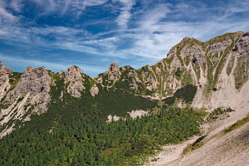 Panoramic view of towers and peaks of the Friuli Dolomites, in the morning light, in Friuli, Italy.