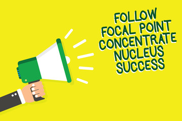 Writing note showing Follow Focal Point Concentrate Nucleus Success. Business photo showcasing Concentration look for target Man holding megaphone loudspeaker yelliw background speaking loud