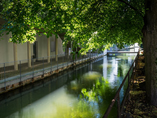 Fototapeta na wymiar Residence with flats beside a canal in the town of Wels in Austria