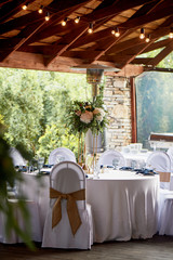 Stand metal thin with floral arrangement. And table number. Wedding floristry