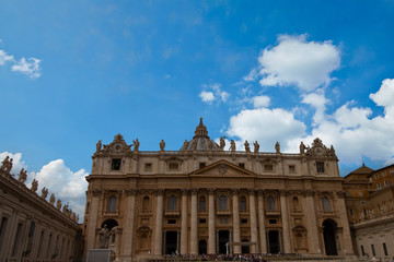 Fototapeta na wymiar St. Peter's Basilica during the day with a beautiful blue sky in the Vatican