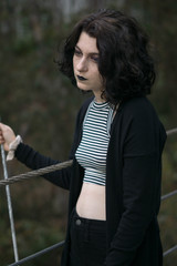 emo goth girl looking dramatically down