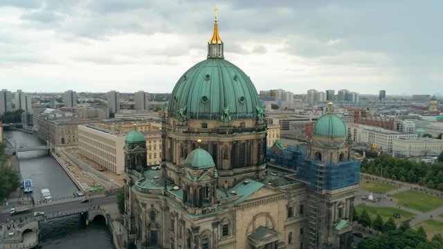 Berlin Cathedral Church - main evangelical church on Museum Island in the Mitte borough in Berlin, Germany, called Berliner Dom. 4K Aerial Panorama of European Capital Cityscape