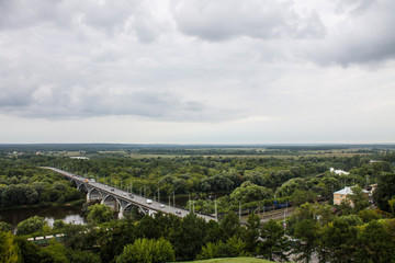 Fototapeta premium Panorama of the valley with a car bridge over the river Klyazma summer day in Vladimir Russia