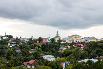 Fototapeta na wymiar Panoramic view of the city of Vladimir, Russia summer a cloudy day on the background of green trees