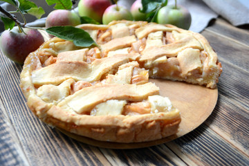 Homemade delicious Apple pie on wooden background Autumn baking 