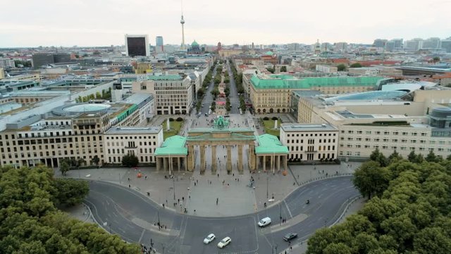 Aerial View of Brandenburg Gate (Brandenburger Tor) - monument in Berlin, Capital of Germany, Europe, with Skyline at the Background. 4K Zoom Out Shot of European City Landmark