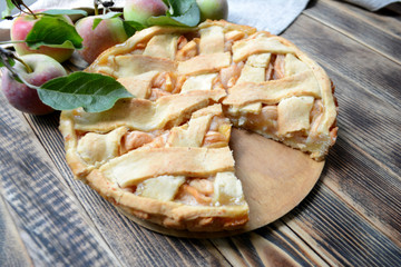 Homemade delicious Apple pie on wooden background Autumn baking 
