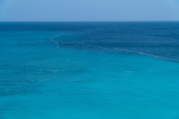 Fototapeta na wymiar Sea surface. Blue background. Azure sea. Azure and turquoise backgrond. Marine waves.
