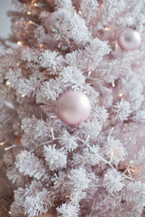 Fototapeta na wymiar pink sofa and pink Christmas tree