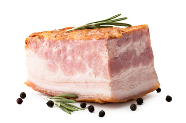 A piece of smoked bacon with rosemary leaves and pepper peas on a white background.