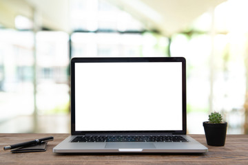 Fototapeta premium Desk Laptop with blank screen on table