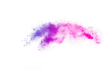 Freeze motion of colorful color powder exploding on white background.  Paint Holi.