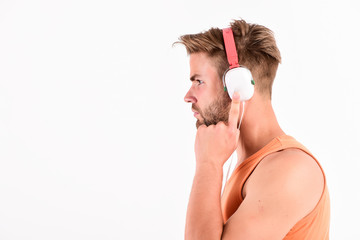 ebook and online education. music education. sexy muscular man listen ebook. man in earphones...