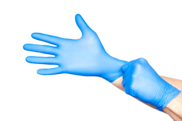 Doctor putting on gloves isolated on white