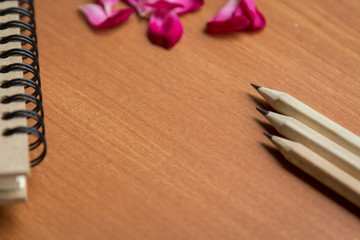 pencil book and wood background