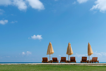 Summer Tranquil Scene, Three Umbrells at Seashore