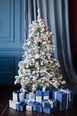 Christmas tree with decorations and gift boxes