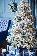 Christmas tree with decorations and gift boxes