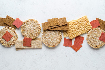 Different types of crispbread (whole-grain buckwheat, rye, wheat, oat, vegetable).