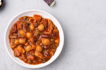 vegetable grains peas soup in tomato sauce