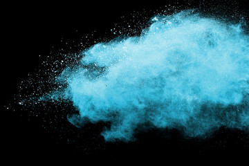 Fototapeta na wymiar Blue sky color powder explosion on black background.