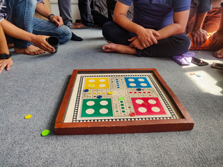 Group of friends playing Ludo