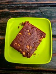 Brownie served in a green plate. Top view