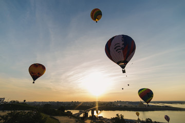 Colorful balloons flying over Nizhny Novgorod Russia at sunset