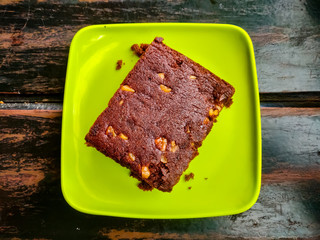 Brownie served in a green plate. Top view