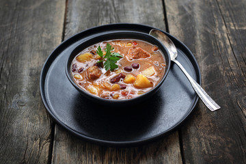 Goulash soup, aromatic venison goulash soup with vegetables and spices.