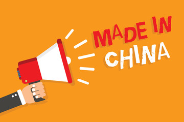 Conceptual hand writing showing Made In China. Business photo showcasing Wholesale Industry Marketplace Global Trade Asian Commerce Man holding megaphone orange background message speaking