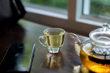 hot tea on wood table, a cup of tea