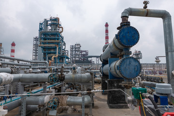 view of the refinery against the cloudy sky