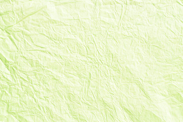 Obraz na płótnie Canvas Old crumpled lime green paper background texture