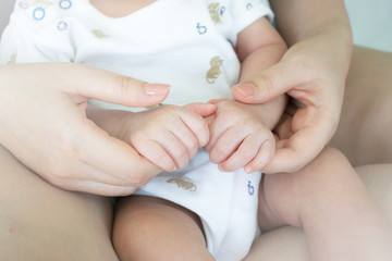 Fototapeta na wymiar Mother holding her child's hand