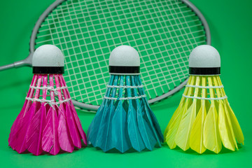 Badminton rackets and feathered shuttlecocks
