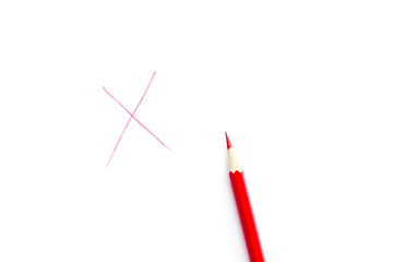 Red cross drawn with pencil isolated on white background. Top view, flat lay composition.