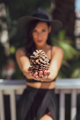 Tall mixed race woman in summer fashion poses outdoors