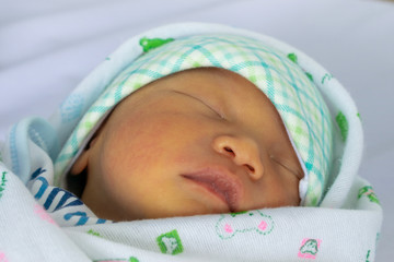 Asian newborn baby was wrapped in cloth after bathing