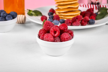 close up of raspberries in a plate
