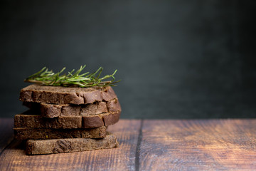 Sliced dark brown bread made of rye and wheat flour