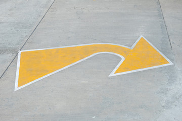 Yellow arrow traffic sign indicates minor road to turn left to major road