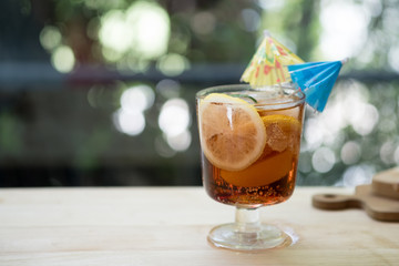 Close up of glass with beautiful refreshing lime slice and peach